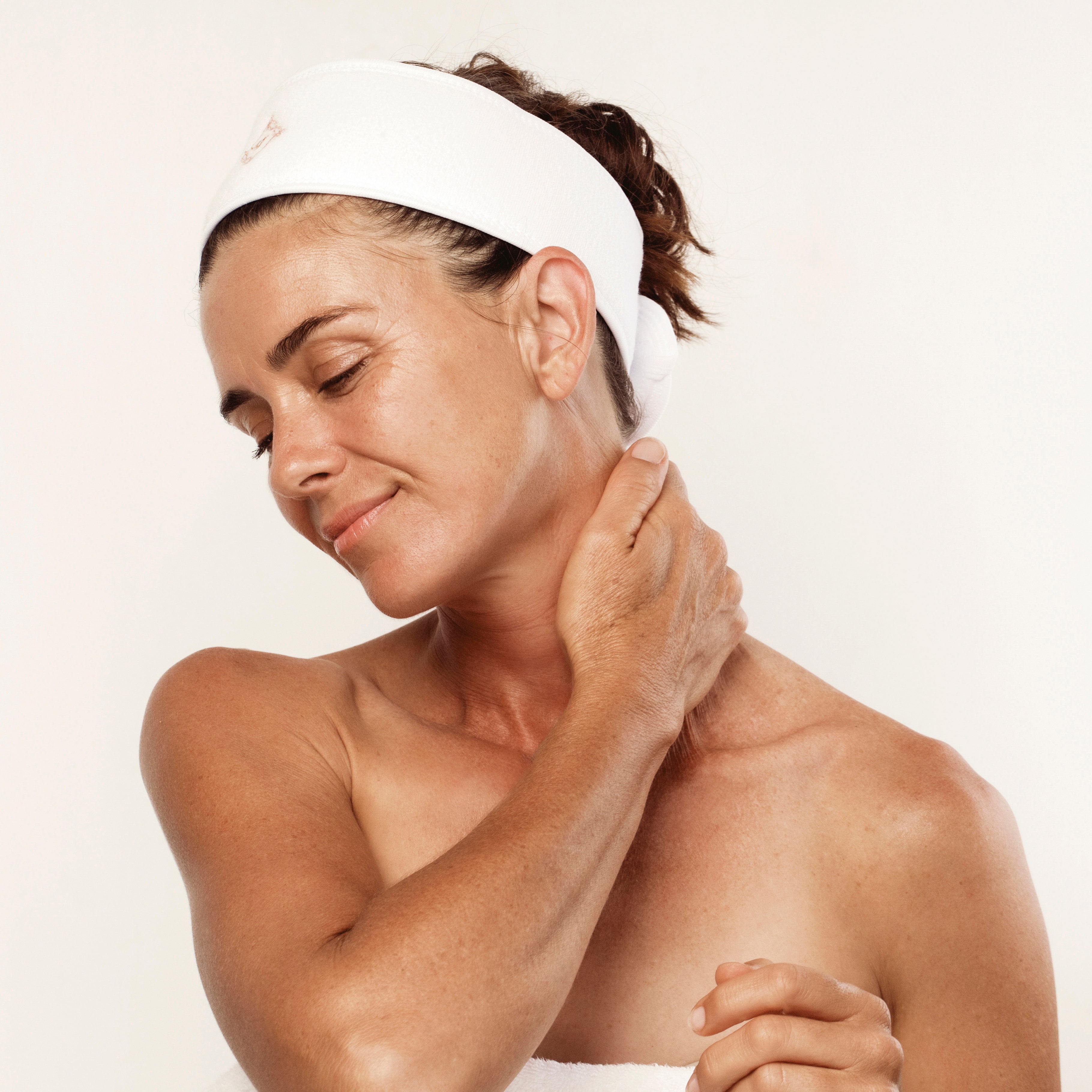 woman massaging neck